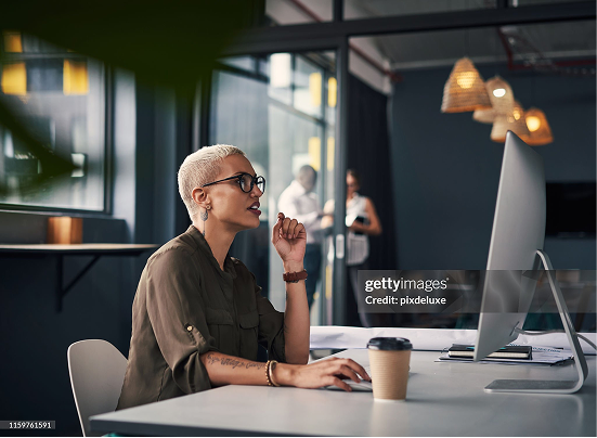 Visa leader working at a desk in an office.